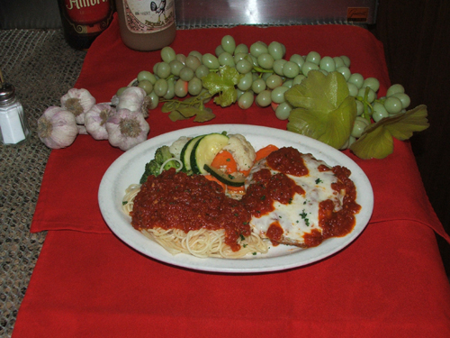Eggplant Parmigiana with pasta and vegetables.