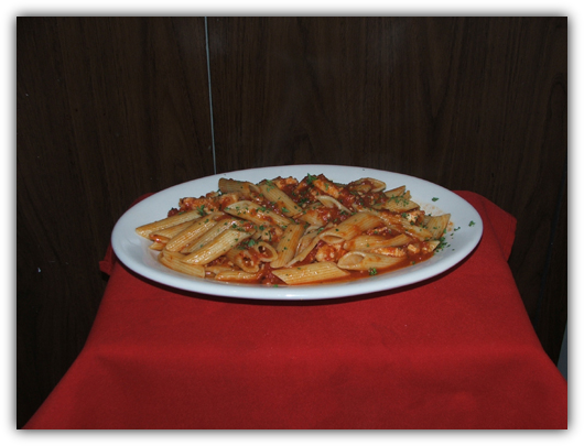 Penne Arriabiata Con Pollo with chicken and spicy sauce.