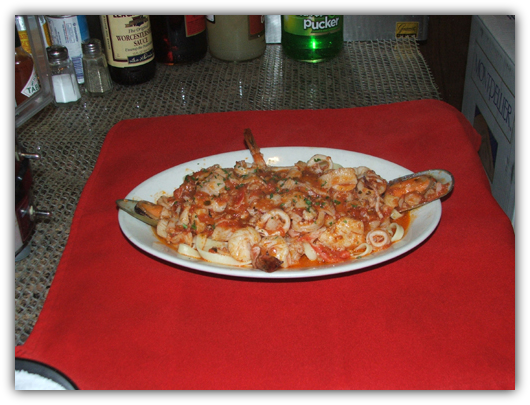 Fetuccini Pescatori with seafood in tomato sauce.