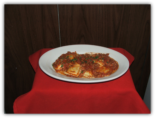 Ravioli Bolagnese. Stuffed beef or cheese with meat sauce.