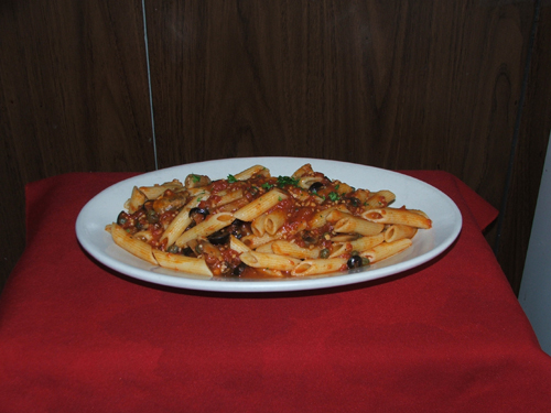 Penne Puttanesca with mushrooms, capers, black olives and tomato sauce.