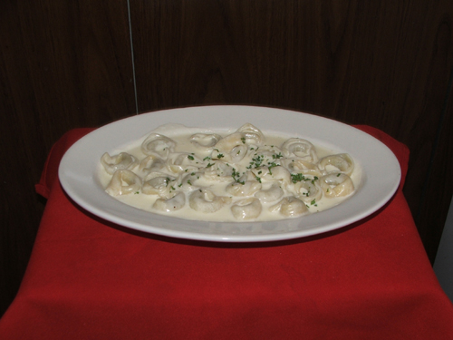 Tortollini Alla Pana. Stuffed with veal or cheese in a light cream sauce.