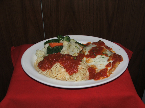 Vitello Parmigiana. Breaded veal, marinara sauce and cheese.